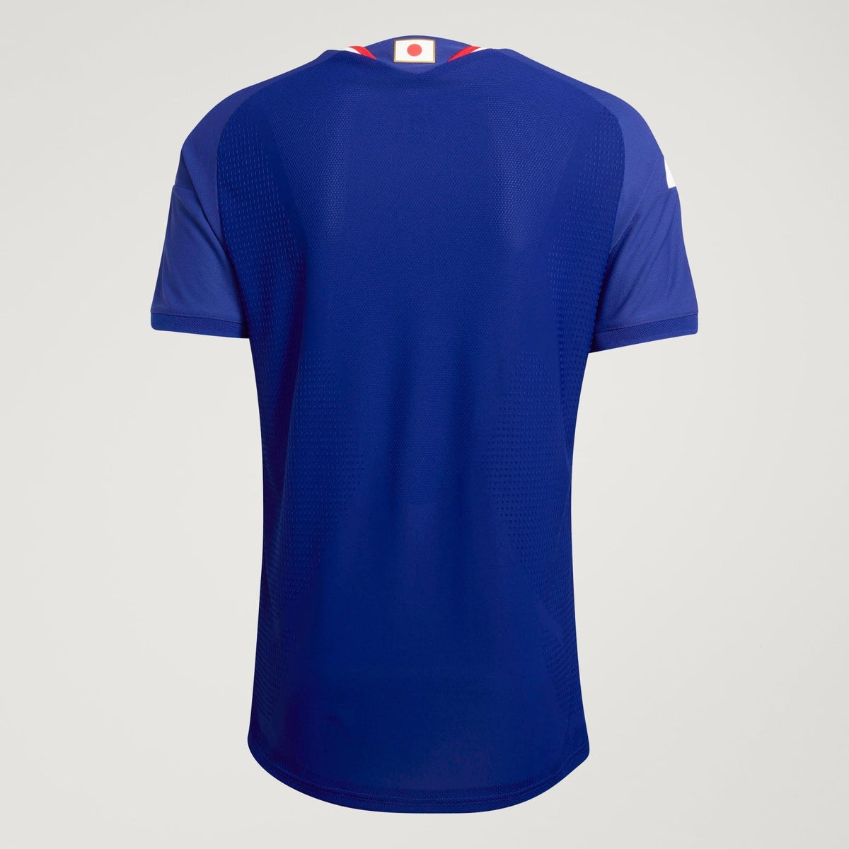 Camisa Japão 2026/27 I Jogador, detalhe do escudo